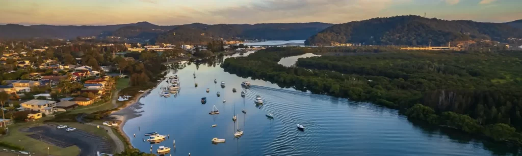 A wide river filled with moored boats