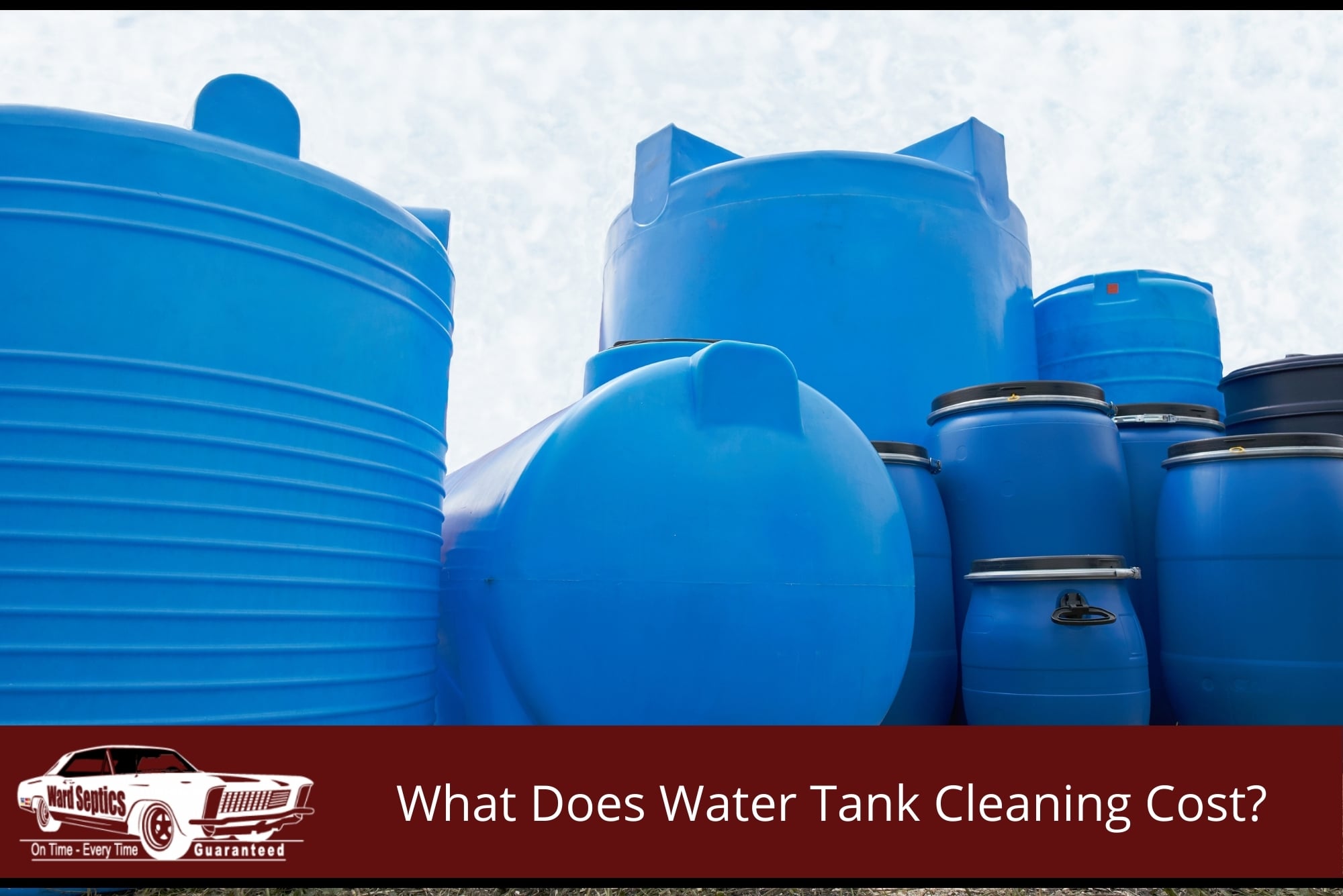 A large assortment of bright blue plastic water storage tanks and barrels of various sizes stacked together.