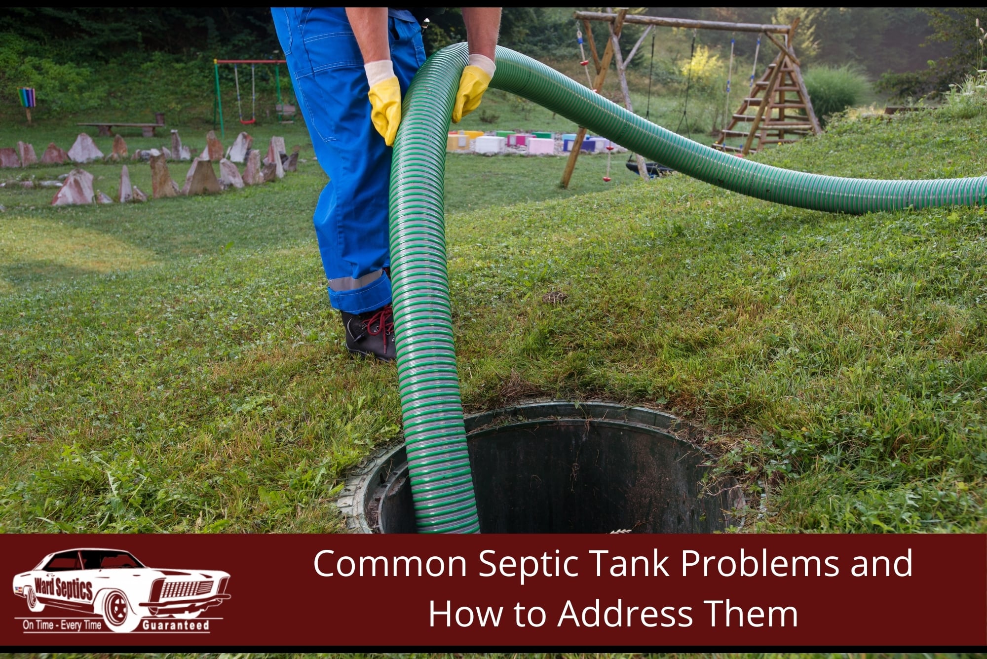 A technician wearing yellow gloves feeds a thick green vacuum hose into an open septic tank riser.