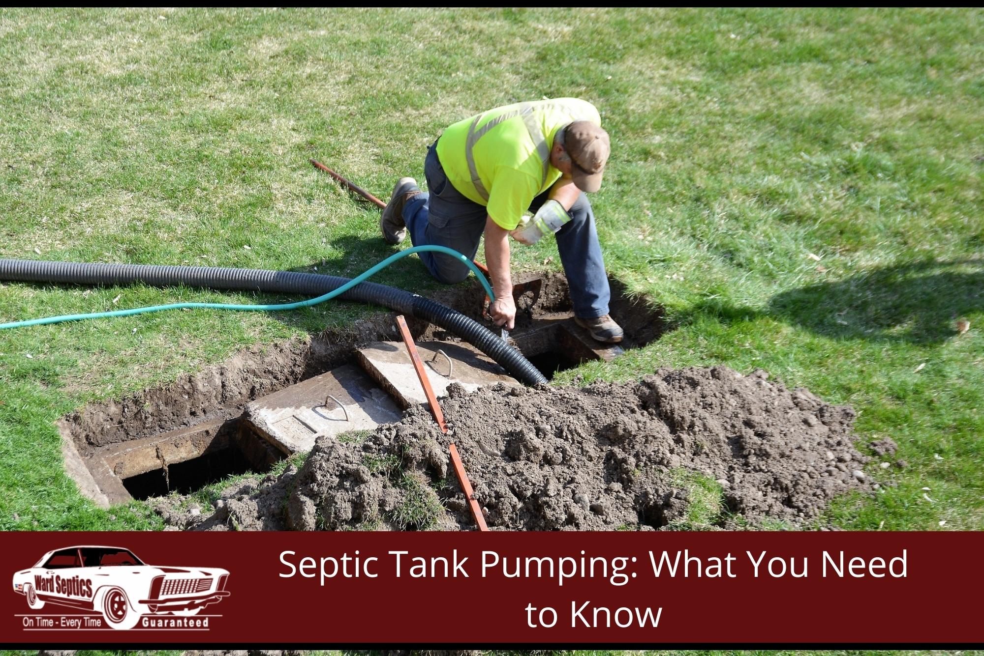A worker in a high-visibility shirt servicing an uncovered underground septic tank on a lawn.