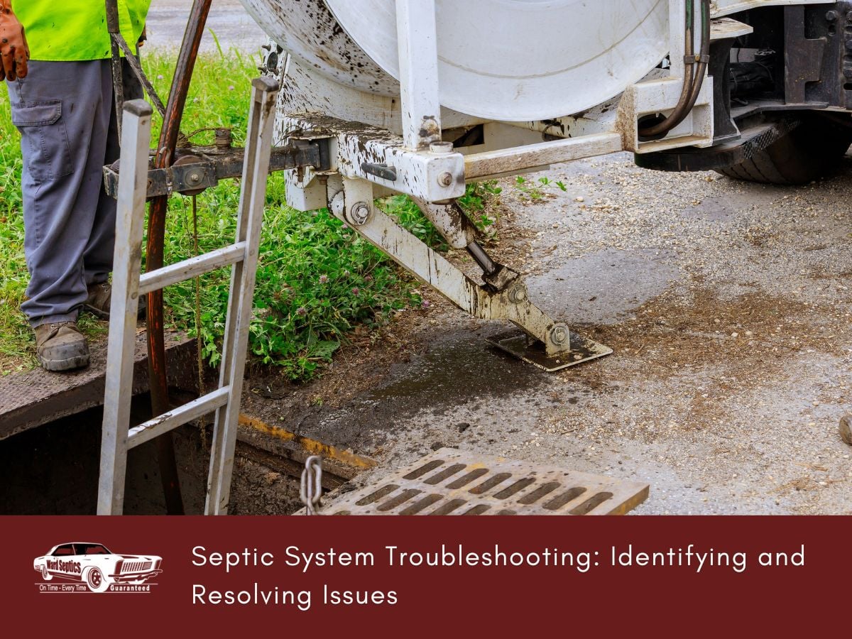 A technician stands by a septic pumping truck with a hose extended into an open underground tank.