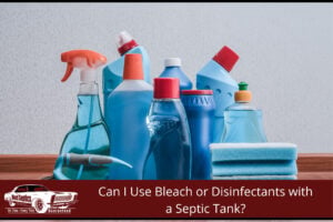Household bleach and disinfectant spray bottles on a kitchen bench — common cleaning products that can affect a septic tank when overused.